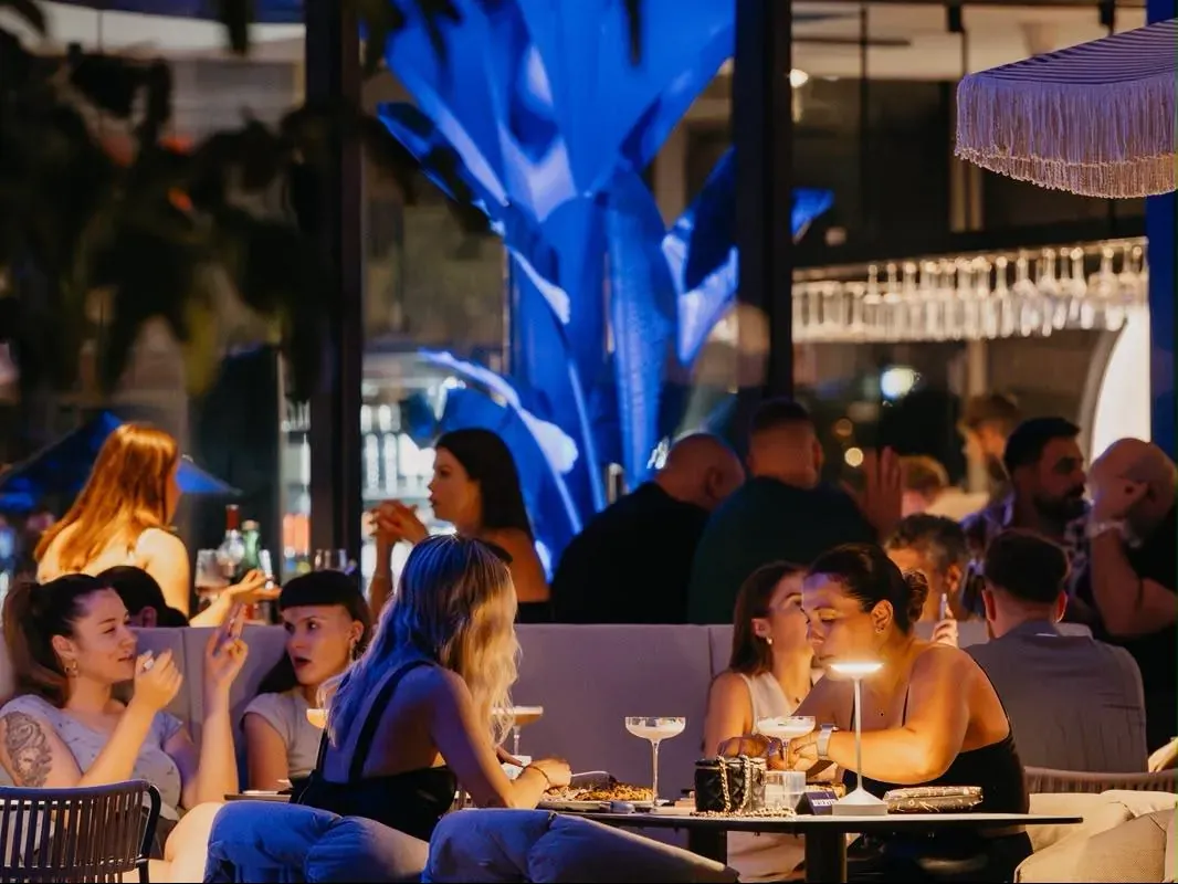 Tables and drinks on the terrace at Central Beach Split in the evening