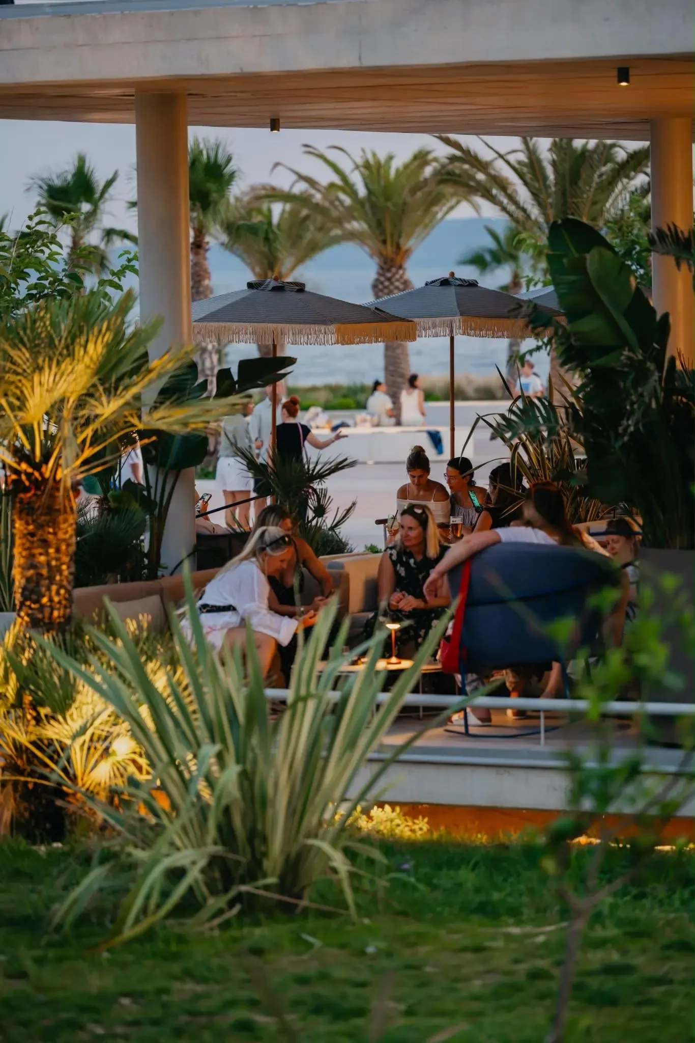Central Beach Split terrace at golden hour, guests and the Adriatic behind