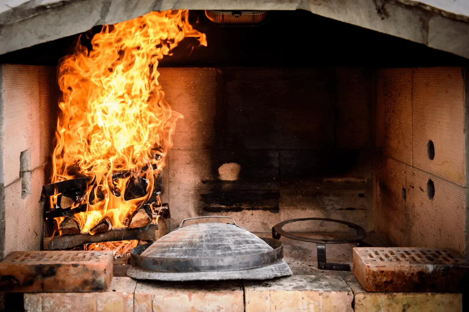 Traditional Dalmatian peka, lamb and potatoes roasted under an iron bell lid