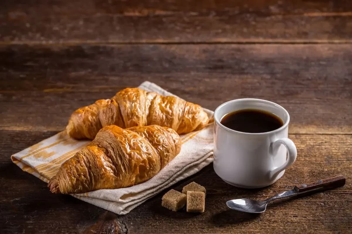 Fresh croissants and a cup of black coffee, a classic Split breakfast