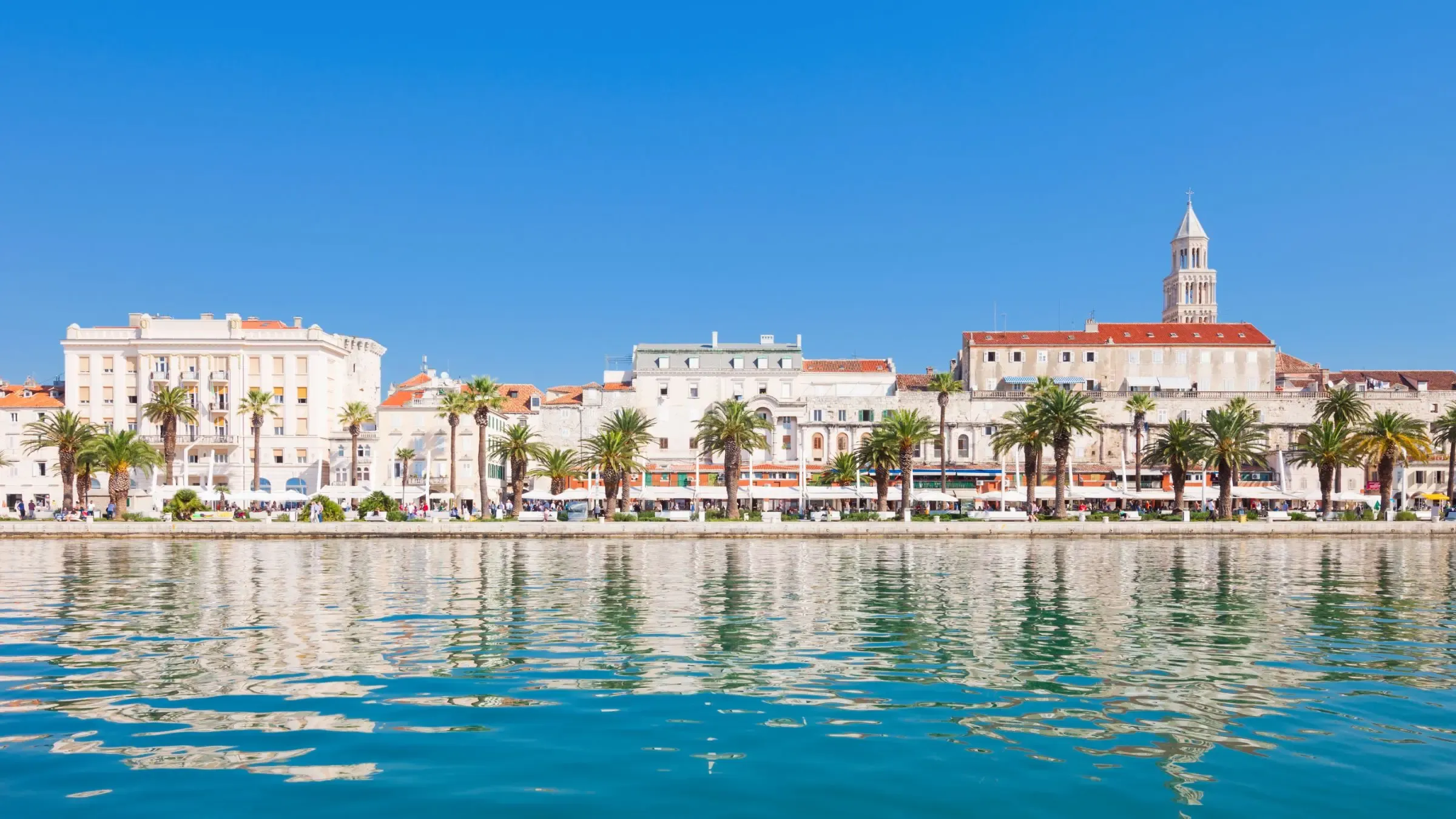 The palm-lined Riva promenade and old town of Split, Croatia, seen from the sea